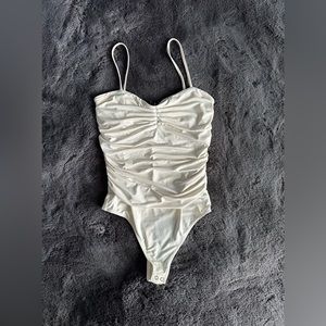 Cream Express scrunched bodysuit